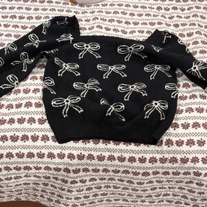 Off-the-Shoulder Black Bow Knit Sweater - Women's